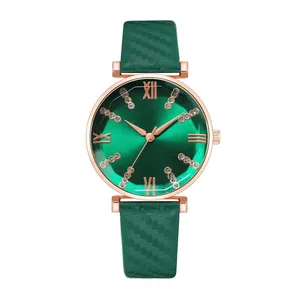Detail of green sunray dial watch with rose gold case and textured leather strap