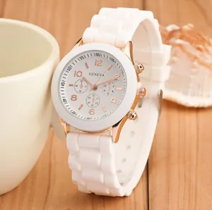 Elegant white silicone strap quartz watch with rose gold case on a rustic wooden desk