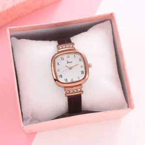 Square rose gold quartz watch with rhinestones and brown leather strap in a gift box