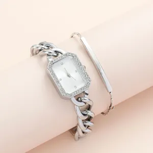 Elegant silver square watch and bracelet set with rhinestones and chain strap on stand