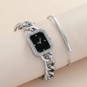 Detail of silver rectangular watch with crystal bezel and matching minimalist bracelet