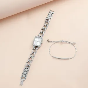 Detail of silver square watch with rhinestone bezel and matching metal chain bracelet