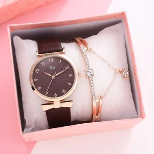 Women's quartz watch and star charm bracelet set displayed in a pink gift box