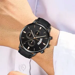Men's chronograph watch with black dial, rose gold markers and leather strap on wrist