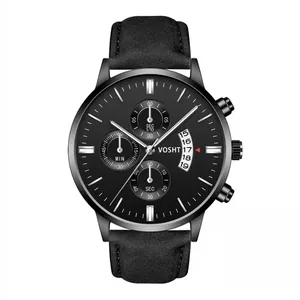 Detail of all-black chronograph watch featuring a matte leather strap and three sub-dials