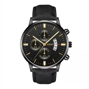Close-up of black chronograph watch dial with gold markers and three functional sub-dials