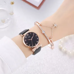 Close-up of elegant rose gold watch and matching star charm bracelet on a female wrist