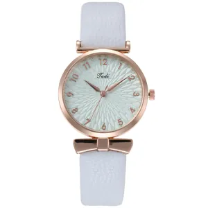 Women's Tadi watch with rose gold case, light green dial, and white leather strap