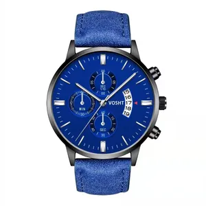 Detail of blue chronograph watch face with three sub-dials and visible calendar date window