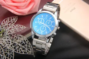 Macro view of blue dial quartz watch with silver steel strap and chrono details