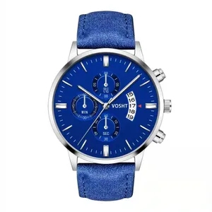 Detail of blue dial chronograph watch with date display and silver stainless steel case