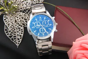 Detail of blue chronograph dial with three sub-dials and silver stainless steel strap