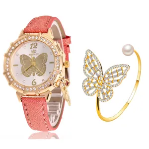 Détail d'une montre à quartz pour femme avec cadran papillon et bracelet assorti doré