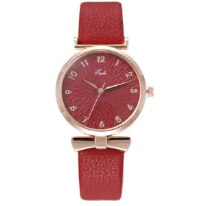 Elegant women's watch with red sunray dial and rose gold accents on white background