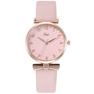Close-up of Tadi watch featuring pink petal-patterned dial and rose gold case detail