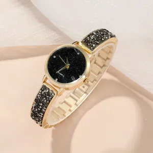 Elegante goldene Quarzuhre mit schwarzem Sternenzifferblatt und Diamant-Gliederarmband