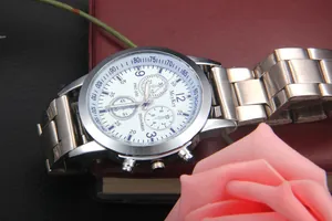 Detailed macro view of the silver stainless steel chronograph dial with blue tachymeter