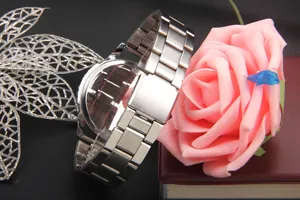 Detailed macro view of the brushed stainless steel watch band and secure fold-over clasp