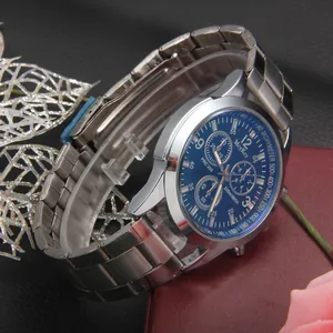 Men's business quartz watch with blue dial and silver stainless steel strap from side angle