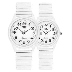 Minimalist white quartz couple watches with elastic bands and large Arabic numerals