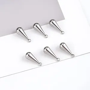 Detailed view of six polished stainless steel teardrop pendants for DIY jewelry making