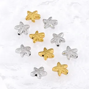 Detailed view of gold and silver starfish spacer beads for DIY jewelry making