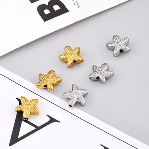 Macro shot of gold and silver starfish spacer beads with textured finish for DIY jewelry
