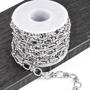 Detailed view of silver stainless steel hammered oval link chain for DIY jewelry making