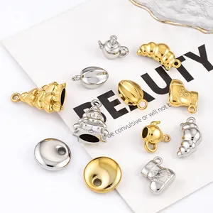 Detailed macro view of assorted stainless steel holiday charms for DIY jewelry making
