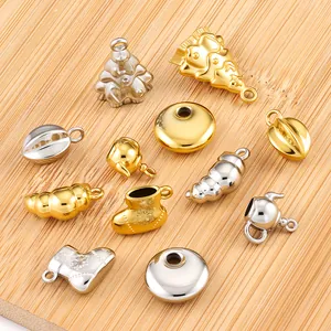 Detailed macro view of assorted gold and silver stainless steel DIY jewelry pendants