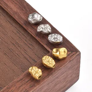 Macro shot of irregular baroque style stainless steel beads for DIY jewelry making
