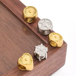 Detail view of various stainless steel DIY heart and star beads for jewelry making