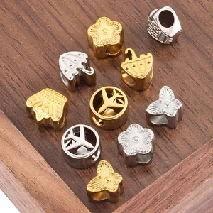 DIY stainless steel spacer beads in gold and silver showing butterfly and floral shapes