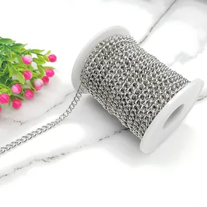 Macro shot of silver stainless steel curb chain for DIY jewelry on white spool