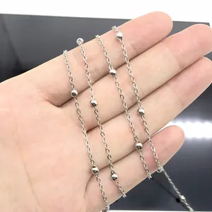 Handheld view of silver stainless steel station bead chain for DIY jewelry making
