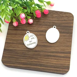 Stainless steel oval sun pendant with You Are My Sunshine engraving for DIY jewelry