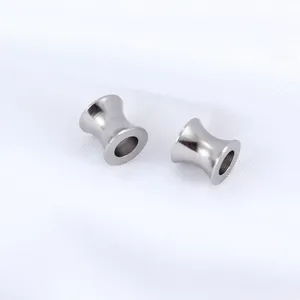 Pair of polished stainless steel double flared flesh tunnels for ear stretching jewelry