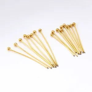 Macro detail of gold plated stainless steel ball head pins for DIY jewelry making