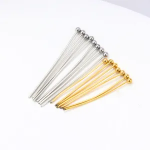 Macro shot of gold and silver stainless steel ball head pins for DIY jewelry making