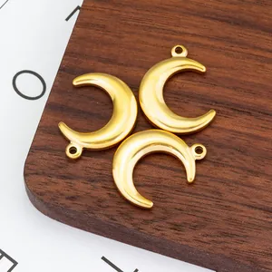 Set of three polished gold crescent moon pendants made of durable stainless steel
