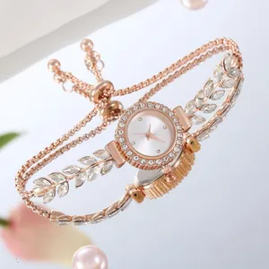 Detail of rose gold bracelet watch with crystal leaf accents and adjustable chain link