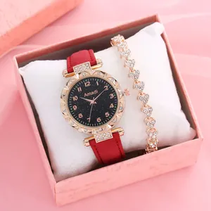 Orologio elegante con quadrante cielo stellato, cinturino rosso e bracciale a cuore in box