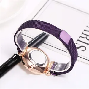 Detail showing rose gold watch case back and purple stainless steel mesh magnetic strap