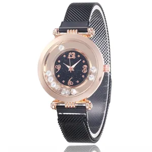 Women's quartz watch with black starry dial and rose gold case on mesh band