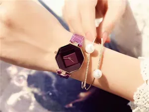 Close-up of purple octagon dial watch with leather strap and pearl bracelet set