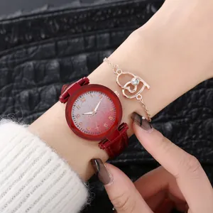 Detail of red starry dial ladies watch paired with a rose gold heart-shaped bracelet