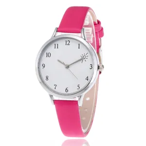 Detail of pink leather watch strap and white dial with heart design and Arabic numerals