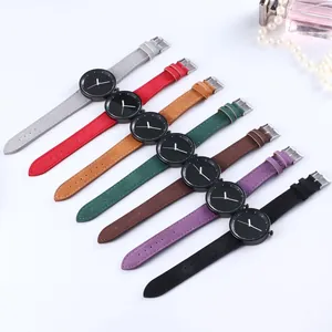 Flat lay of minimalist quartz watches with seven colors of suede leather straps