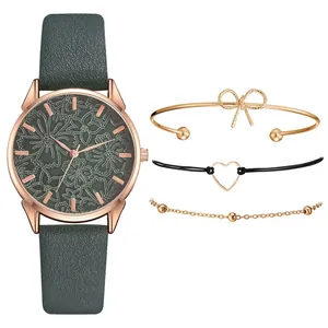 Dettaglio dell'orologio in oro rosa con quadrante floreale e set regalo con bracciali