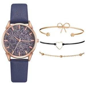 Dettaglio dell'orologio al quarzo oro rosa con quadrante floreale e tre bracciali abbinati